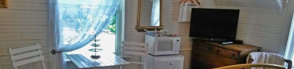 Mountain harbour cozy interior with wooden walls and modern amenities in a mountain retreat.